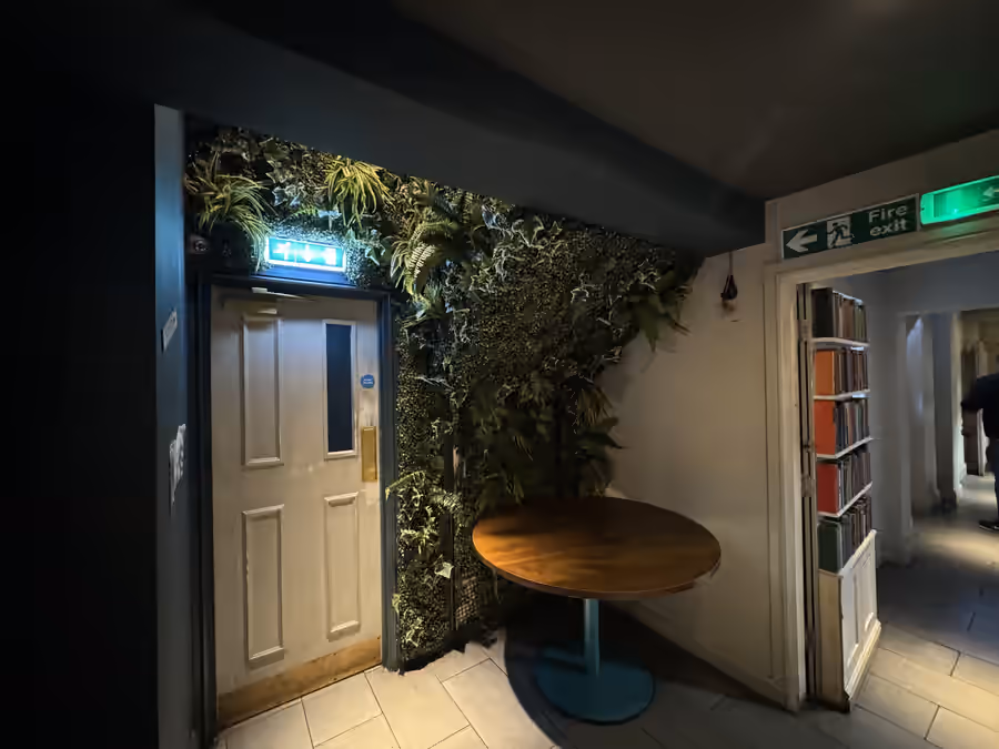 Artificial foliage wall in a commercial venue
