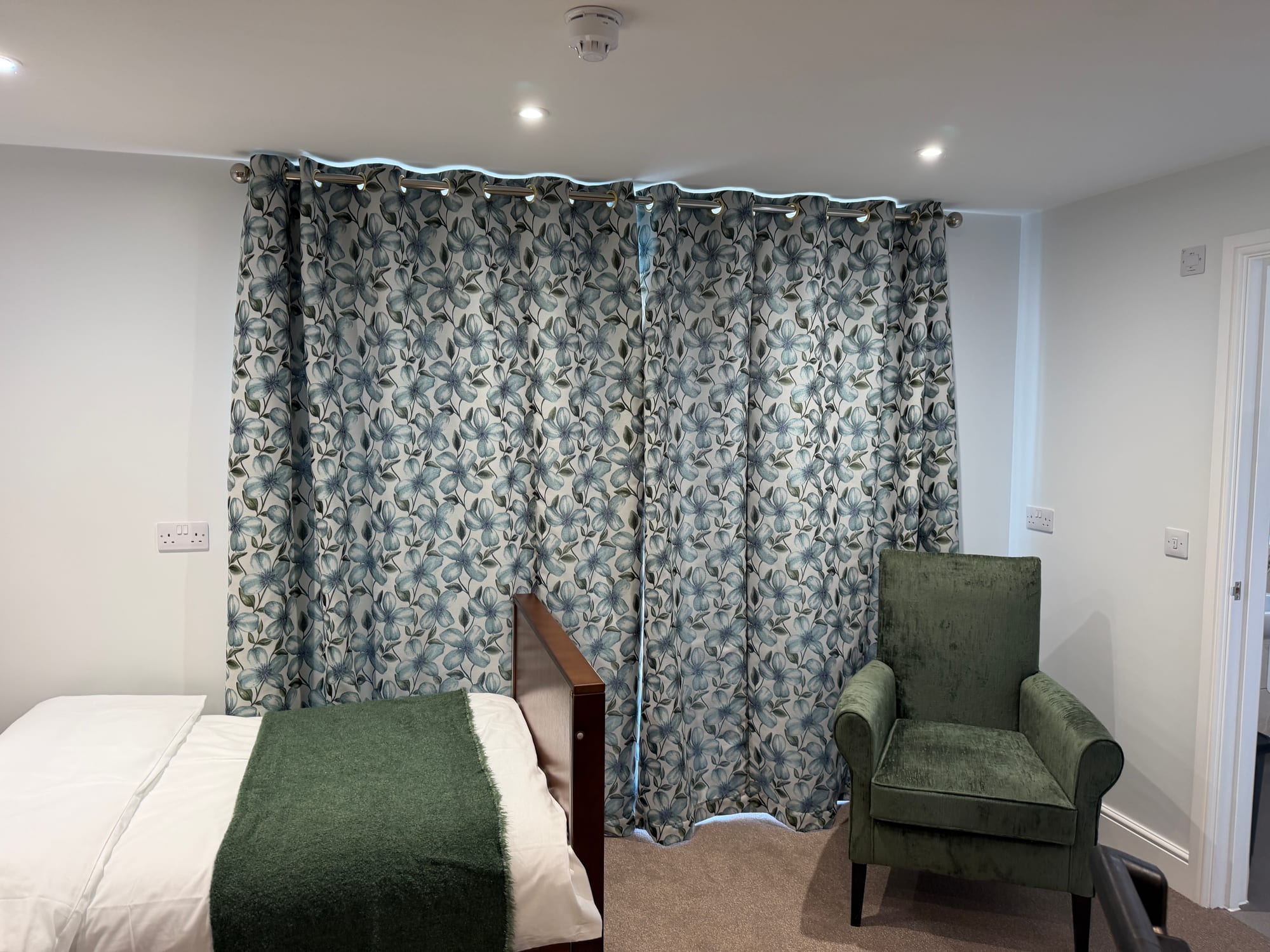 Floral curtains in a care-home bedroom