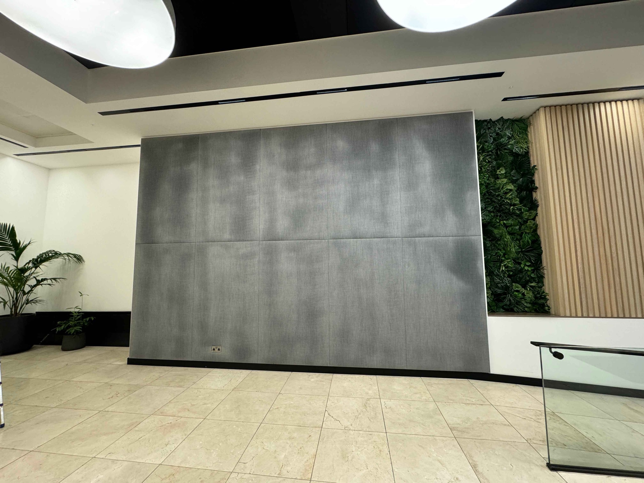 Grey fabric wallcovering panels in a commercial interior