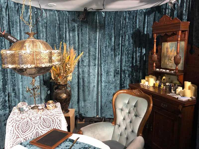 Mixed scenic fabrics and furnishings on an immersive theatre set
