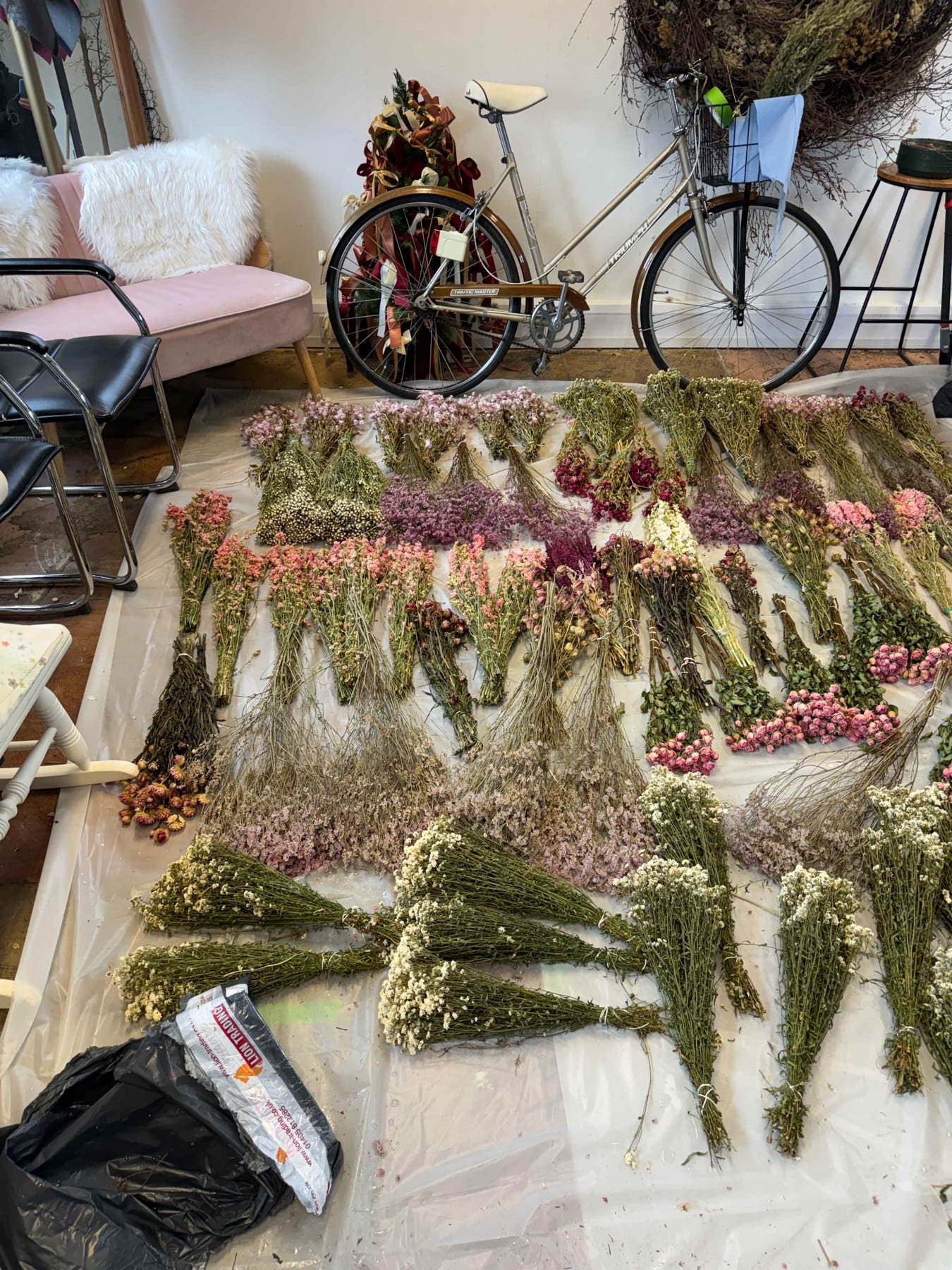Many batches of dried flowers arranged for treatment