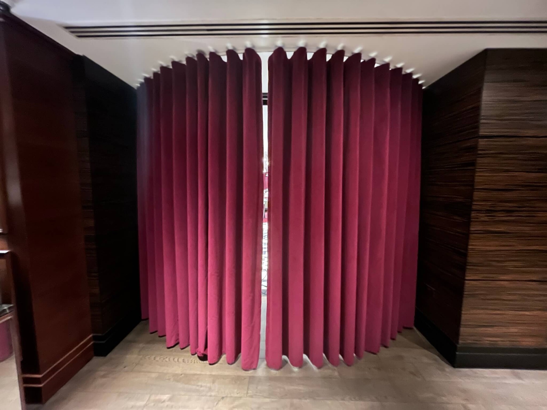 Deep pink curtains in a hotel interior